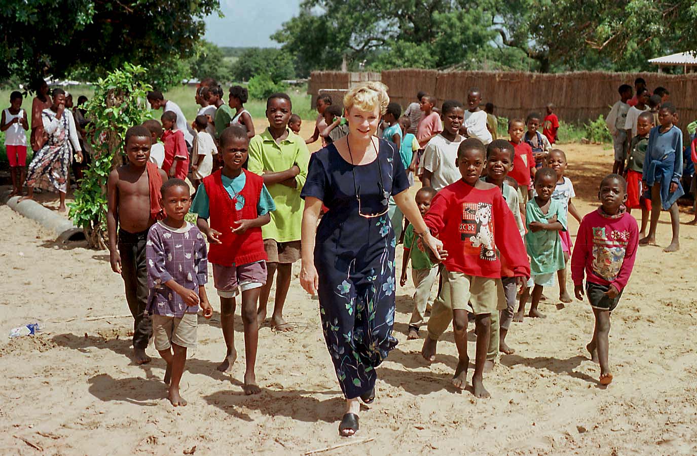 Heidi Baker walking with kids in Mozambique